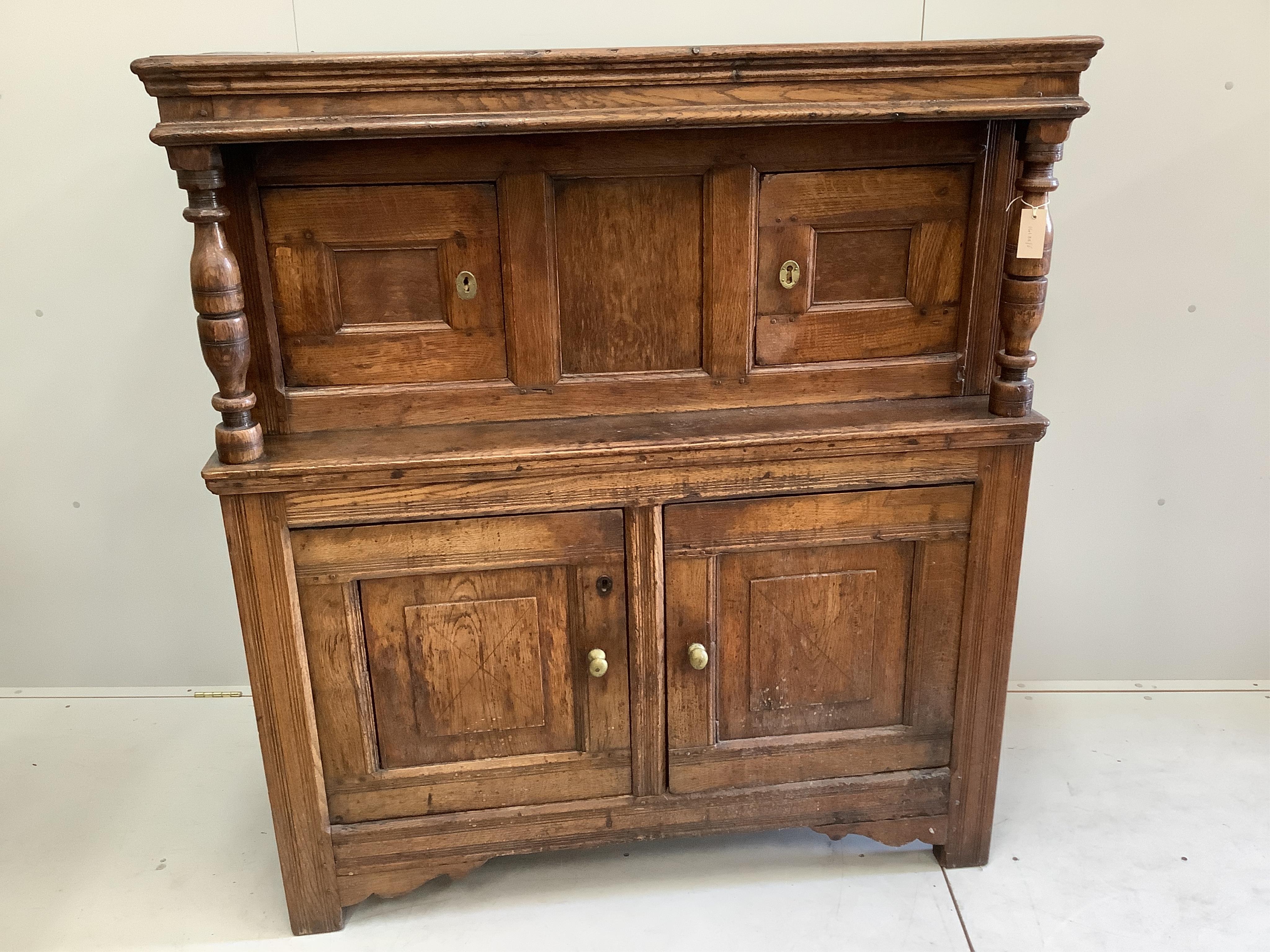 An 18th century oak court cupboard, width 127cm, depth 55cm, height 141cm